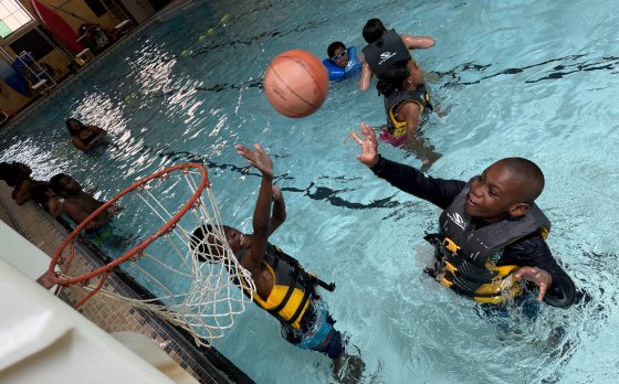 Kids playing basketball at Camp Thunderbird