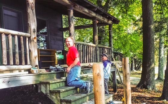 Alumni working on renovating cabins