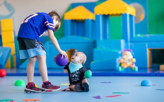 two kids playing in the boat hose at the sands family ymca