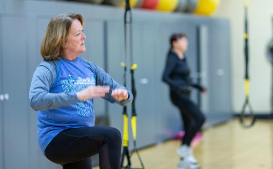 a woman in a TRX class at the northwest family ymca