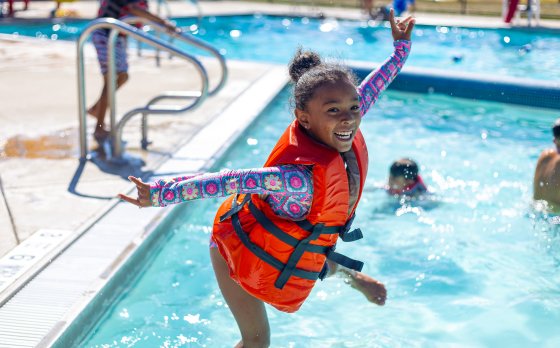 Kid Jumping in the pool at Camp Northpoint