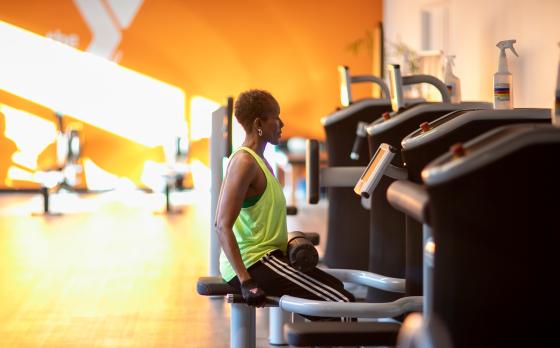 a woman using egym equipment at the ymca at innovation square