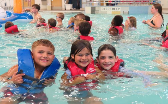 kids playing in the pool at Camp Eastside