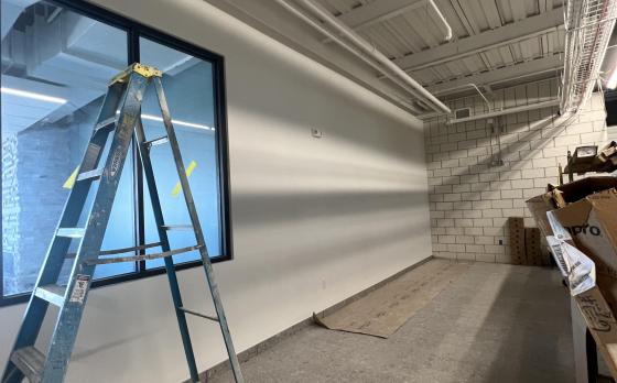 a photo of construction progress at the Sands Family YMCA lounge area outside of the Rayburn Family Community Room