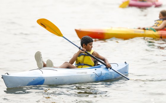 camper in kayak in lake
