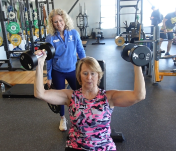 member and personal trainer working together