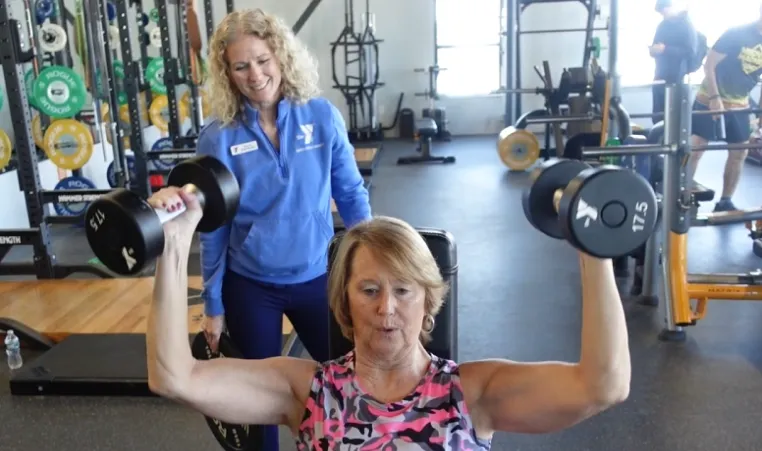 member and personal trainer working together