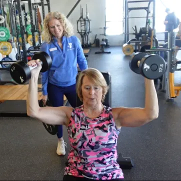 member and personal trainer working together