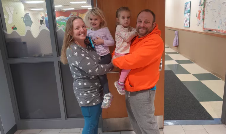 the alfano family of four poses for a picture at the northwest family ymca