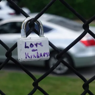 love on fence outside lewis street ymca neighborhood center
