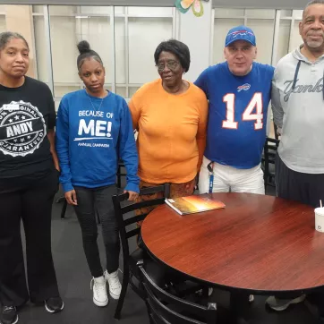 Members and staff at the Maplewood Family YMCA pose together during a grieving group session at the branch.