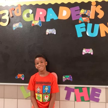 a young boy at School 8 in our Power Scholars Academy 