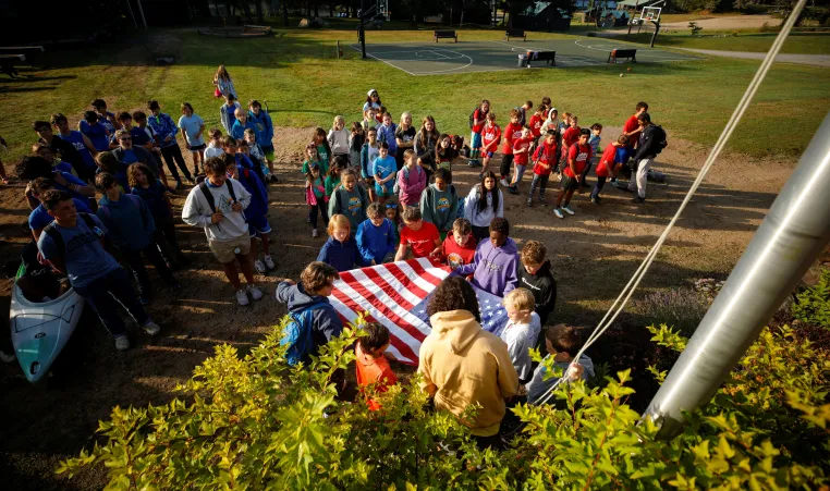 campers at YMCA Camp Gorham hold daily flag ceremony