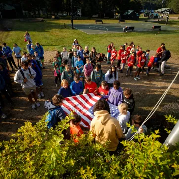 campers at YMCA Camp Gorham hold daily flag ceremony