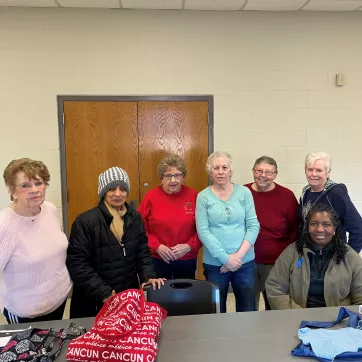 a group of members at the northwest family ymca pose for a picture during one of their handcrafting meetings