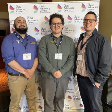 Y Staff James, Ari, and Terrence attending the Child Advocacy Center of Greater Rochester annual meeting