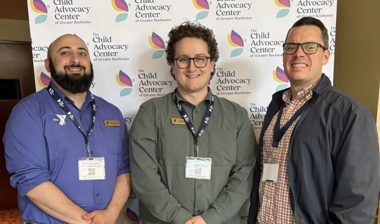 Y Staff James, Ari, and Terrence attending the Child Advocacy Center of Greater Rochester annual meeting