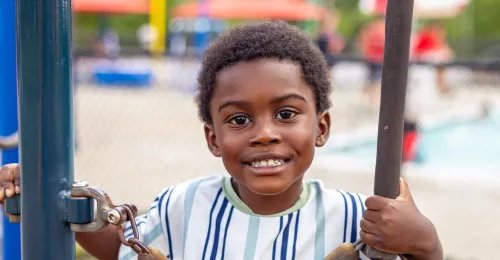 Kid Playing on Playground