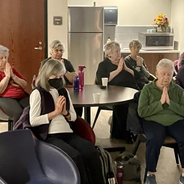 a group at the Schottland Family YMCA doing a meditation session