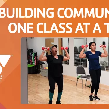 a group exercise class using dumbbells in their exercise with the text "Building Community One Class at a Time"